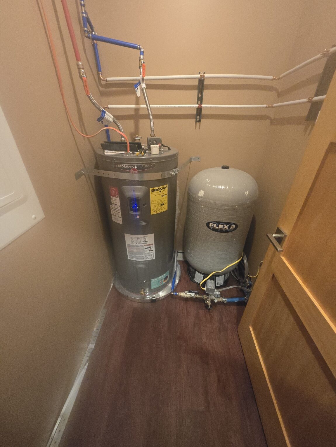 Electric water heater with expansion tank in a laundry closet