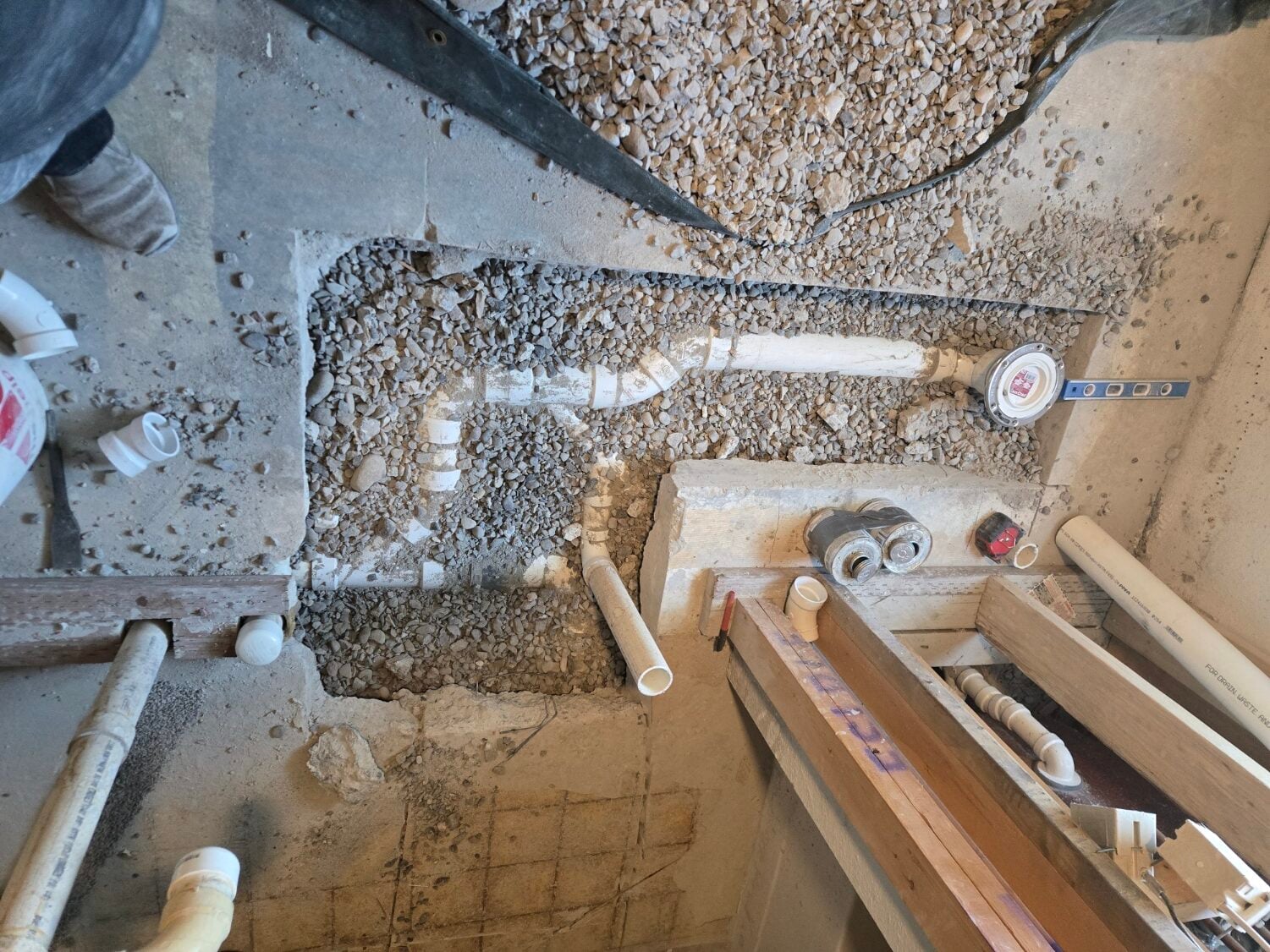 Slab trenched open to reach under-floor pipes