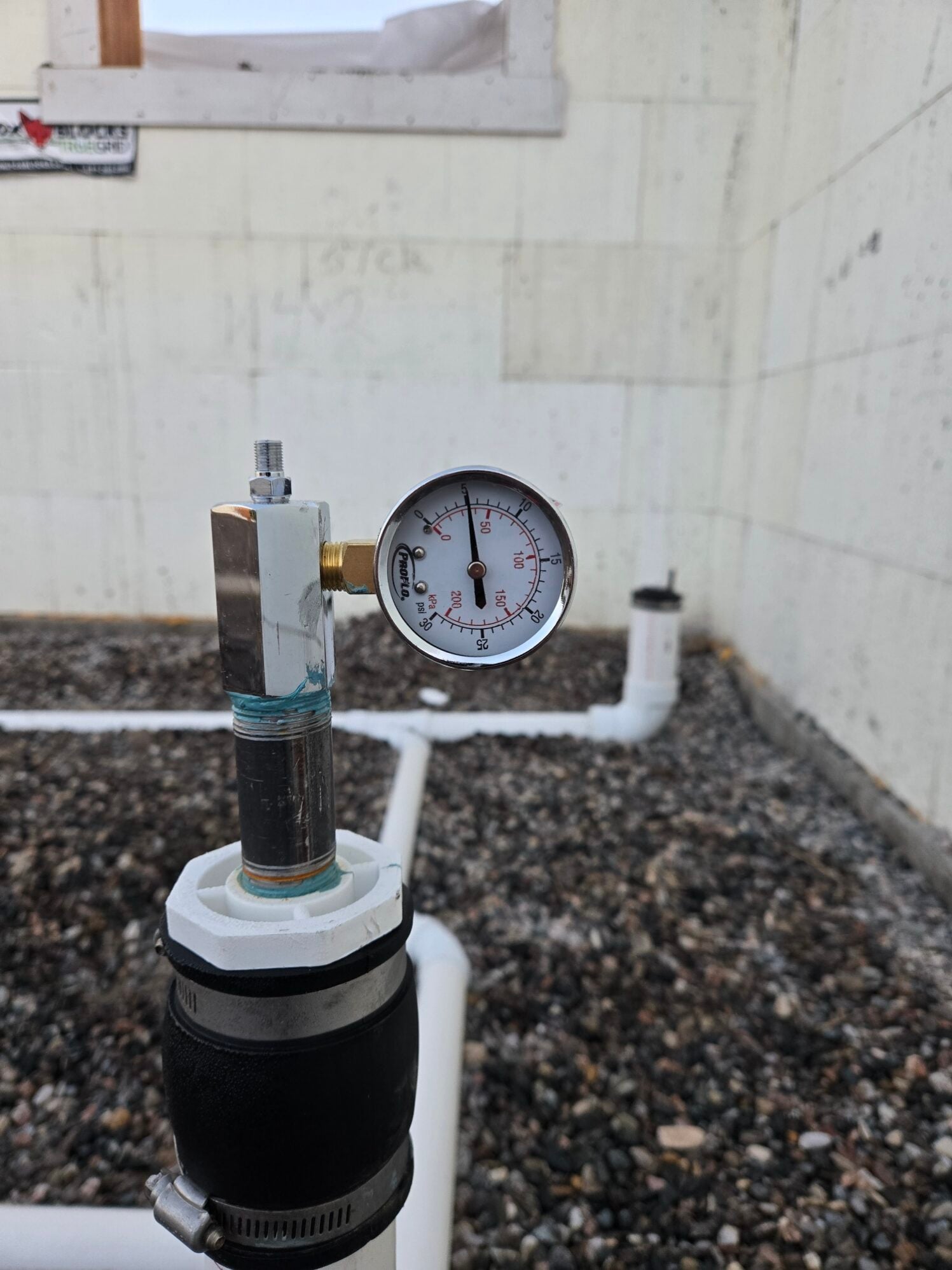 Pressure test gauge on new drain lines