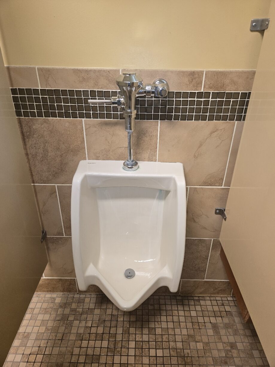 Commercial restroom urinal with flush valve