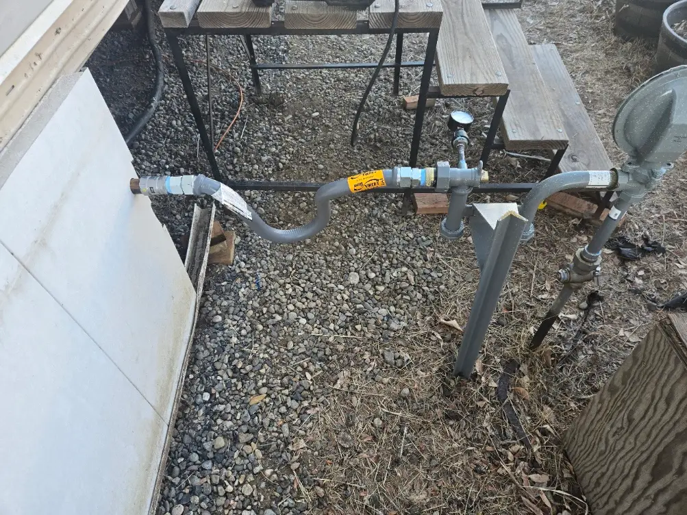 Outdoor gas line and meter piping at a rural property