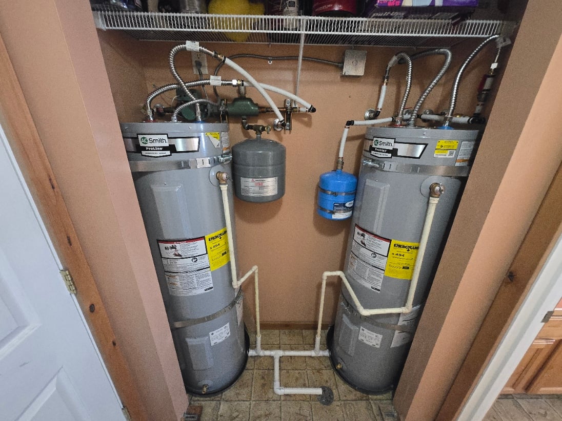 Two new electric water heaters installed with expansion tank