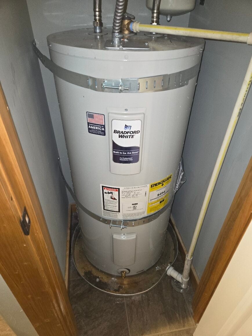 Bradford White water heater installed in a utility closet