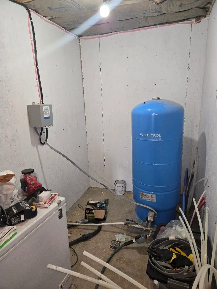 Well water pressure tank in a rural home